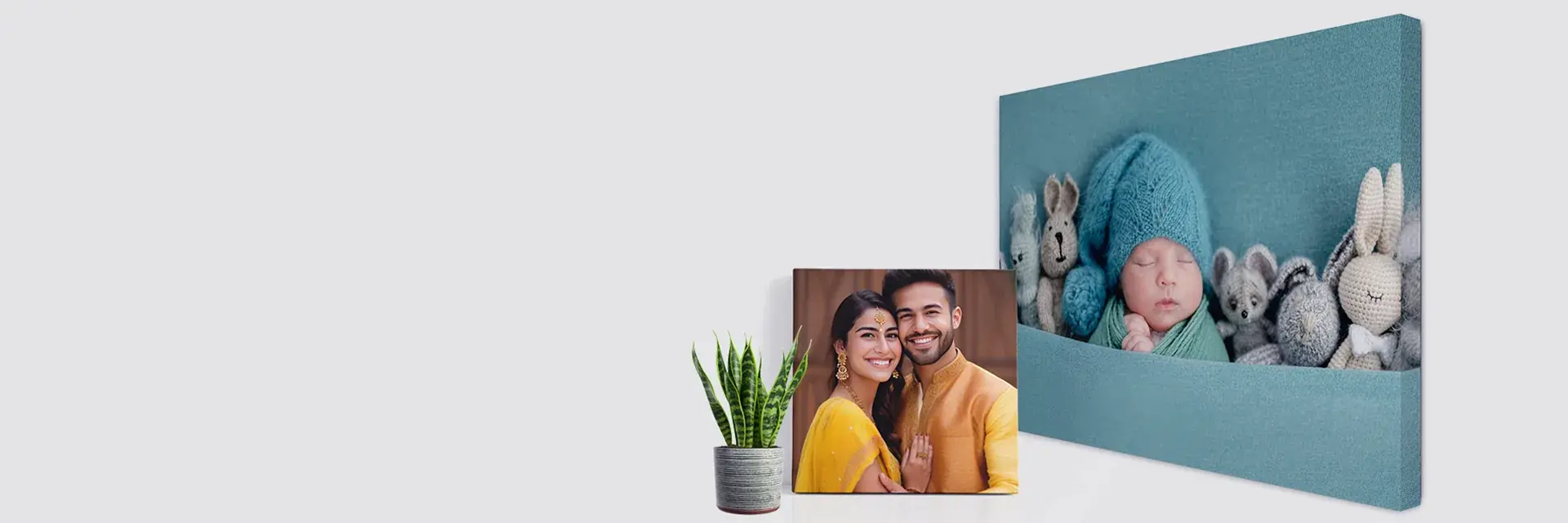 Wrapped canvas of a newborn and a framed couple portrait