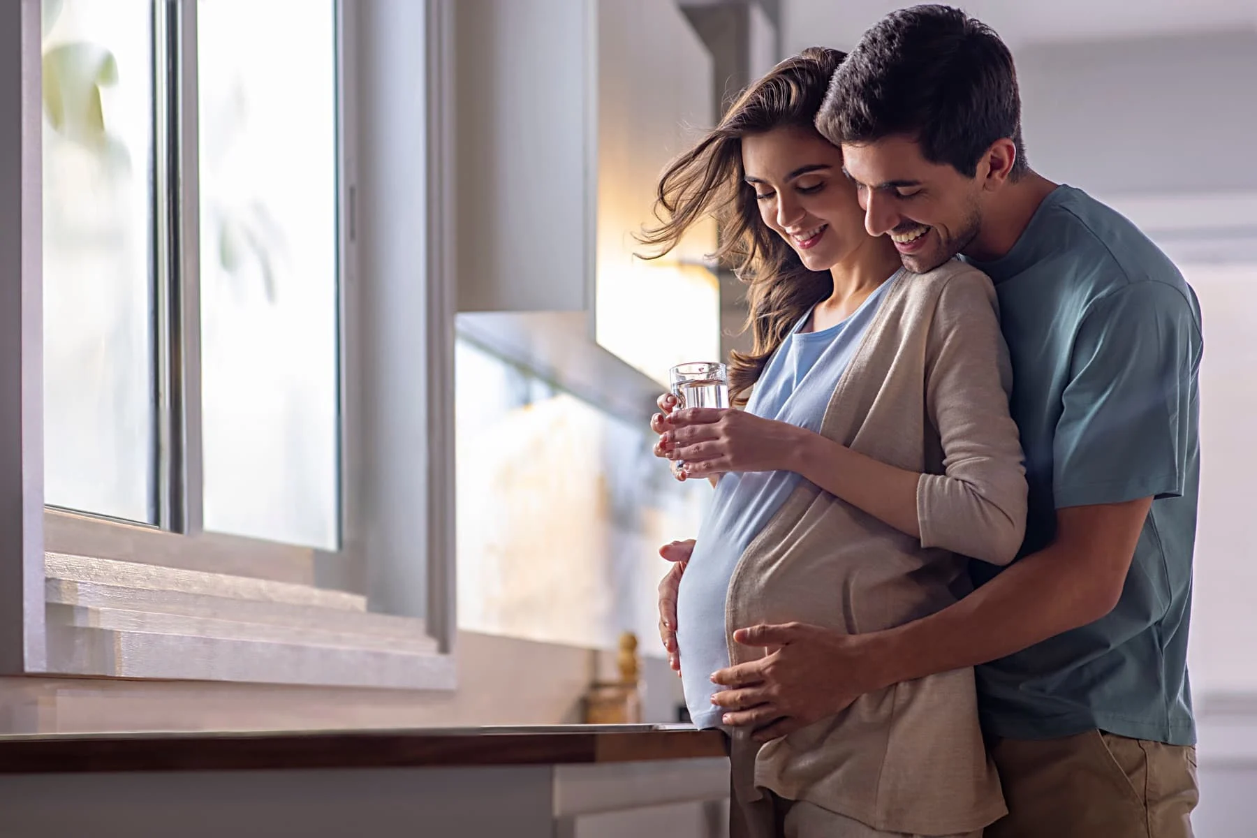 Expecting couple at home