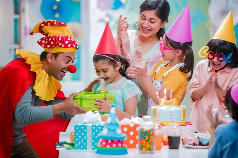 Kids’ birthday party with cake and party hats