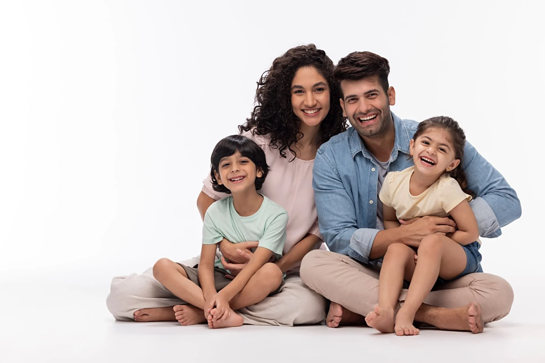 Young family in a white studio