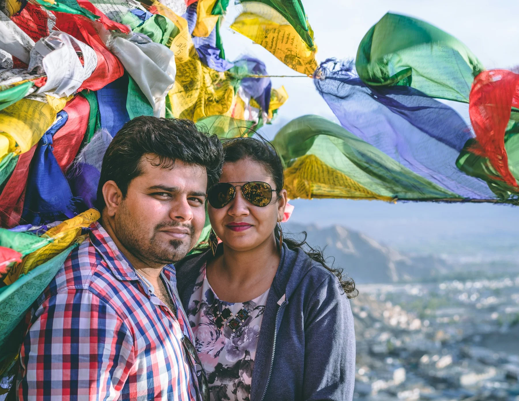 Couple under prayer flags in Leh
