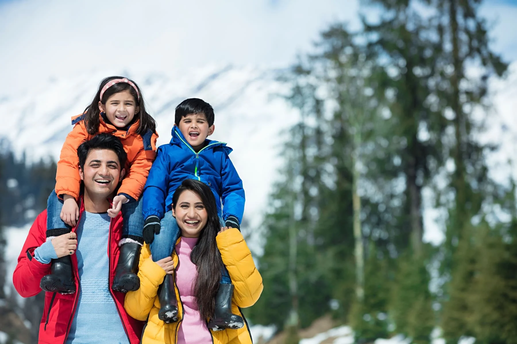 Family on a snowy mountain holiday