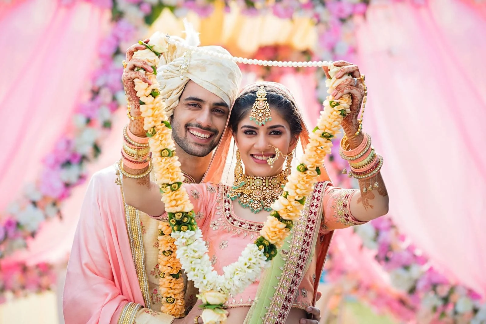 Couple exchanging garlands