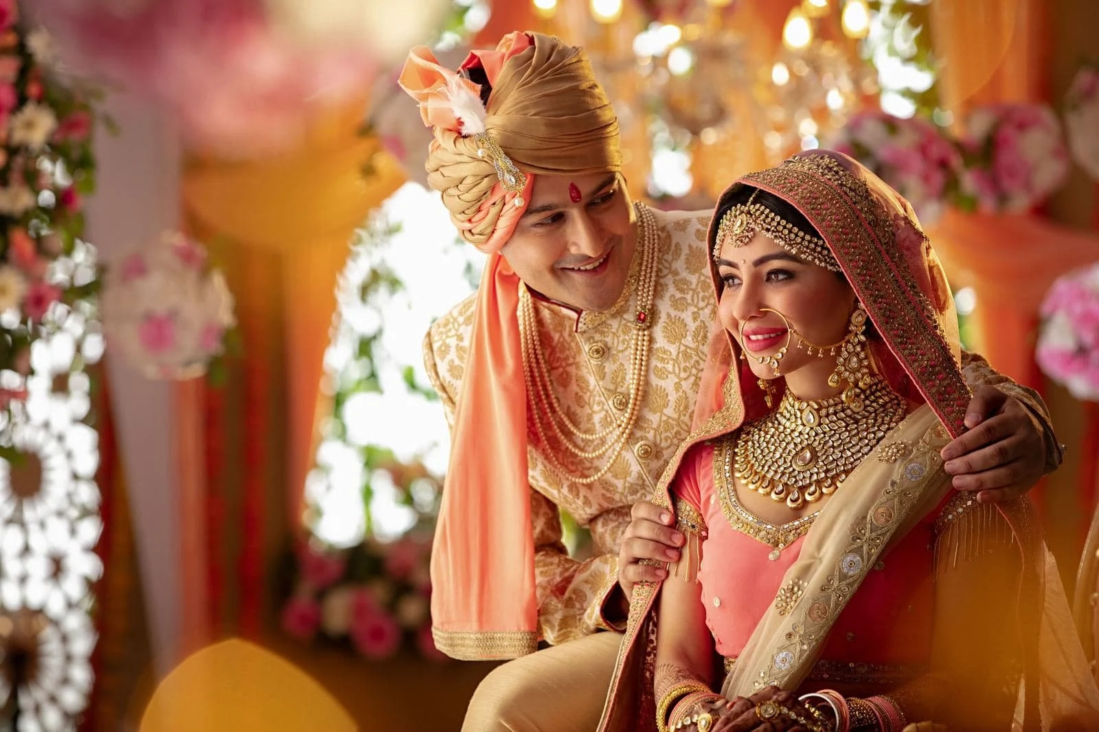 Bride and groom laughing together at their wedding